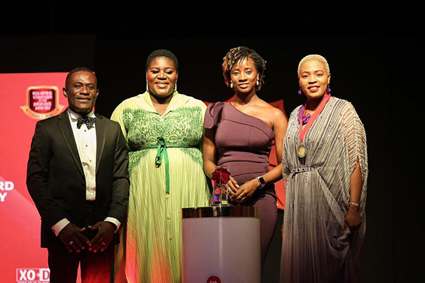 Hollard Ghana team on stage with their CSR Leadership Award at Ghana Insurance Awards