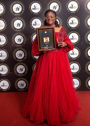 Hollard’s Patience Akyianu holding her Outstanding Woman CEO of the Decade award