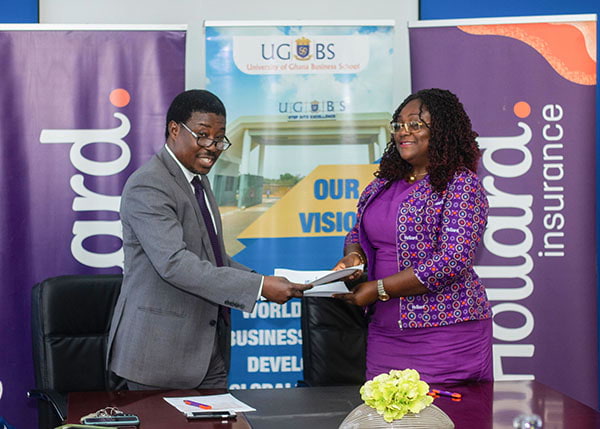 Hollard Ghana and UGBS signing a MOU at their ceremony