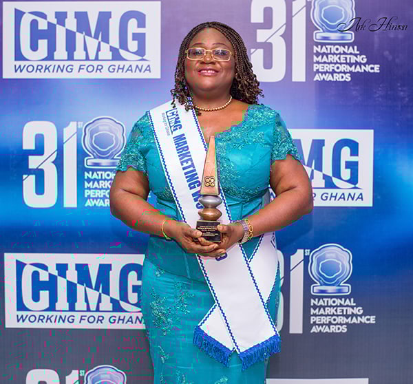 Patience Akyianu with her award as the Marketing Woman of the Year at CIMG